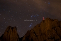 Night starry sky with Orion over Montserrat mountain, Catalonia, Spain.