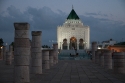 Mausoleum of King Mohammed V (finished 1971) and columns on the Yacoub al-Mansour esplanade in Rabat, Morocco.  The intended  mosque from Al-Mansour was left incomplete in 1195 adc, with only the beginnings of several walls and 200 columns being constructed.