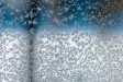 Ice crystals from humidity condensation forming outside a window glass under extremely cold temperatures, Kuhmo, Finland
